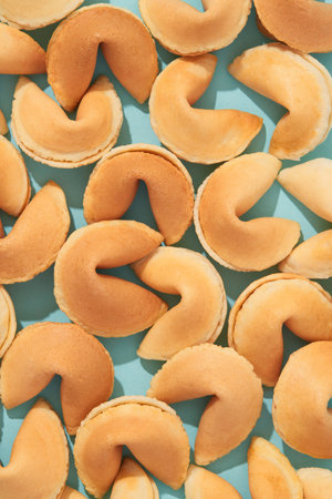 Pattern with fortune cookies on blue background with deep long shadowsの写真素材