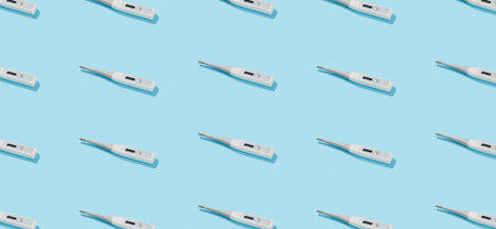 Pattern with digital thermometer on a blue background with deep shadows. Healthcare pharmacy and medicine conceptの写真素材