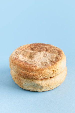 Bolo de caco. Traditional portuguese bread on blue a backgroundの写真素材