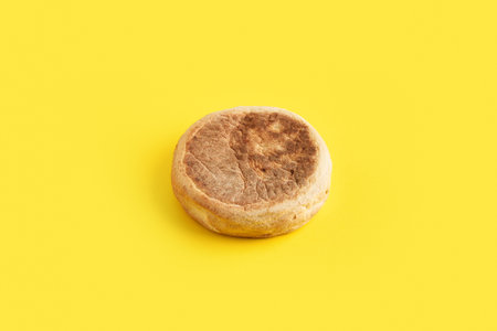 Bolo de caco. Traditional portuguese bread on yellow backgroundの写真素材