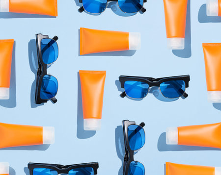 Creative composition with sunscreen lotion and sunglasses. Body care beauty treatment concept