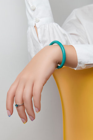 Manicured womans hands with trendy minimal jewelryの写真素材