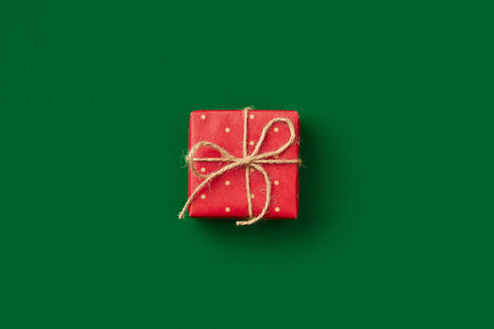 Christmas celebration concept. Gift on green backgroundの写真素材