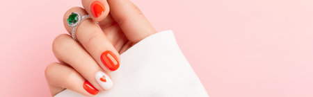 Close up manicured womans hand. Fashionable valentines day nail designの写真素材