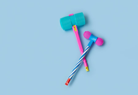 Toy hammer on a blue background for summer festival in June San Juan, Portugal
