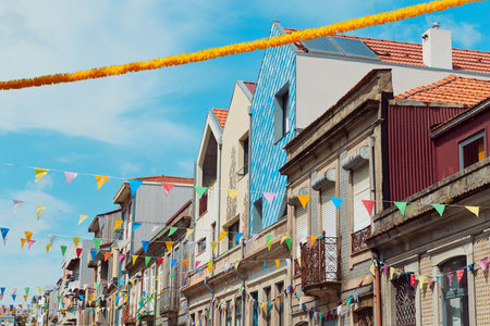 Festive bunting and lanterns decorate a narrow street for summer festival in June San Juanの写真素材