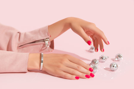 Womans hands with pink nail design. Manicure, pedicure beauty salon concept.の写真素材