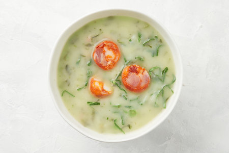 Portuguese style soup Caldo Verde on gray background close upの写真素材