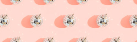 Creative Christmas pattern with shiny disco balls on pink. Retro party time conceptの写真素材