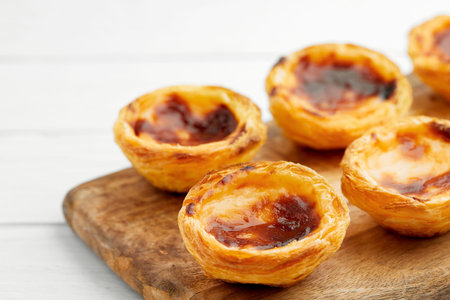 Traditional Portuguese egg tart dessert Pasteis Pastel de nata or Pasteis de Belem on white...