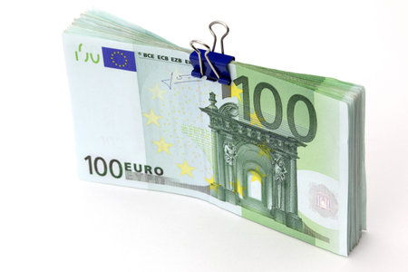 Euro banknotes with binder clip on white background 