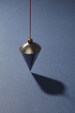 Vertical plumb on blue backgroundの写真素材