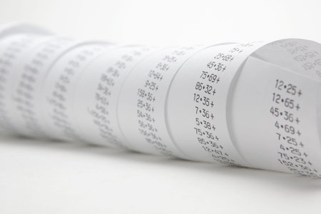 Calculator paper tape rolled upの写真素材