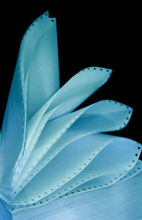 Printer paper in motion on dark background の写真素材
