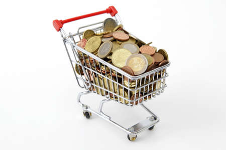 Mini shopping cart with euro coins on white backgroundの写真素材