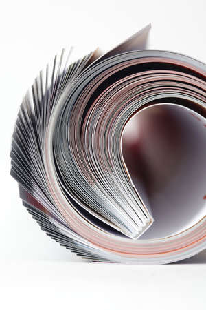 Magazine roll on white background の写真素材