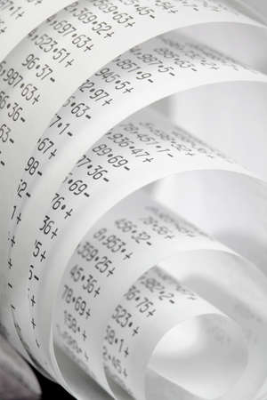 Calculator paper tape rolled up の写真素材