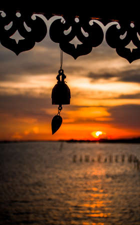 bell and  sunset  backgroundの写真素材