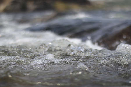 Soft and smooth river side water wavesの写真素材