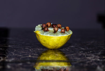 close up photo, cloves inside of yellow lime