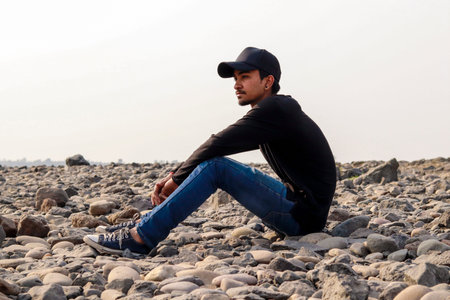 Outdoor Portrait of  indian man sitting around river side