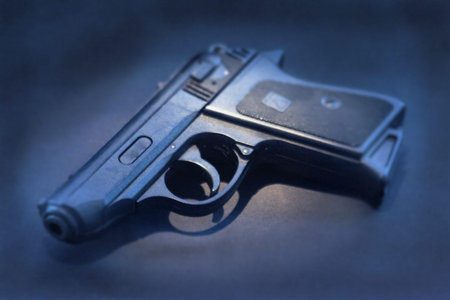 Pistol, lying on the floor, blue toneの写真素材