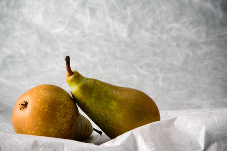 two pears on a structured paper の写真素材