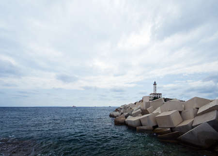 the lighthouse at the harbor of Eivissa, capital of the balearic island Ibizaの写真素材