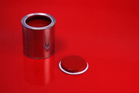 opened can of red varnishの写真素材