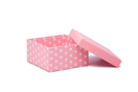 open pink gift box with white polka dots, isolated on white