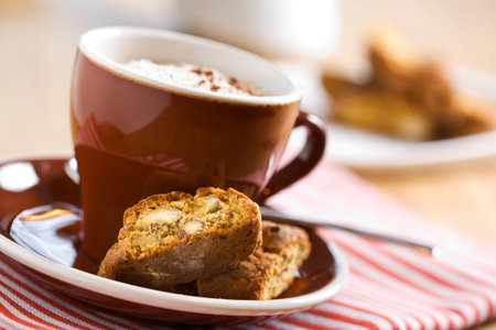 cup of cappuccino with cookiesの写真素材