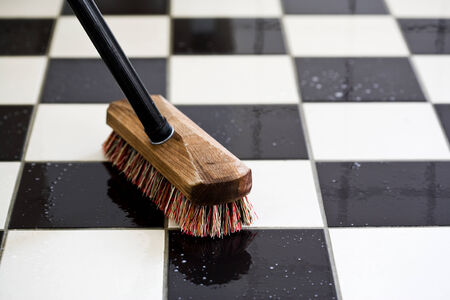 scrubbing a tiled floorの写真素材