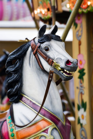 head of horse on childrens roundabout at funfairの写真素材