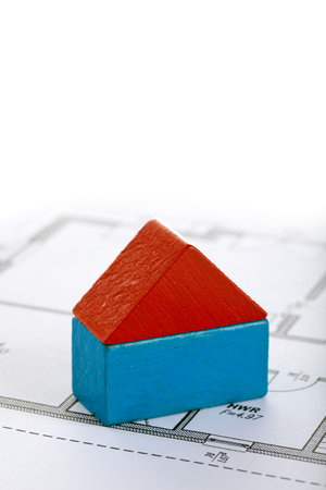 house made of two toy blocks on blueprint of floor planの写真素材