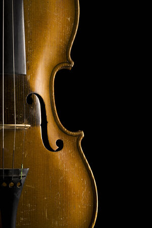 violin close up, f-holes and waist, isolated on blackの写真素材