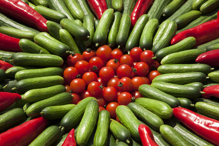 background of tomatoes, zucchini and red peppers の写真素材