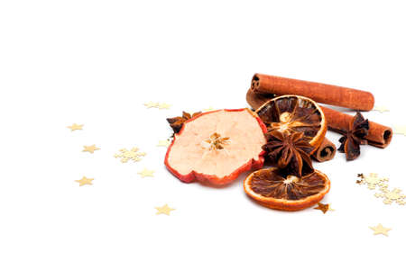 dried orange and apple slices, star anise, cinnamon with golden starsの写真素材