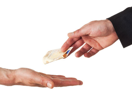 hand of businessman handing fifty euro bill to another hand, isolated on whiteの写真素材