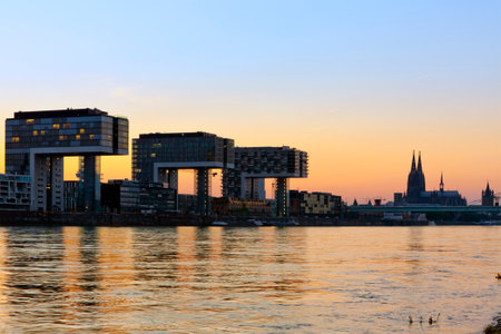 modern buildings at Rheinauhafen and Cologne cathedral at duskのeditorial素材