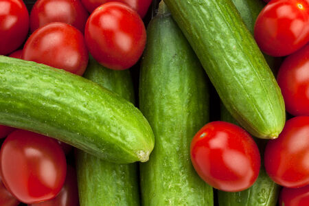 full frame closeup of tomatoes and cucumbersの写真素材