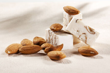 Blocks of soft nougat from Belgium and almondsの写真素材