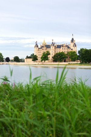 Schwerin Castle and lake, reed in foregroundのeditorial素材