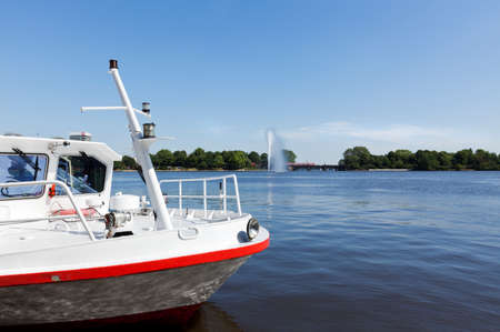 Prow of a tourist boat on Binnenalster lake at Hamburgの写真素材