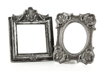 Two empty silver picture frames, vintage style, isolated on white backgroundの写真素材