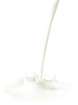 Pouring milk or cream, making a splashの写真素材