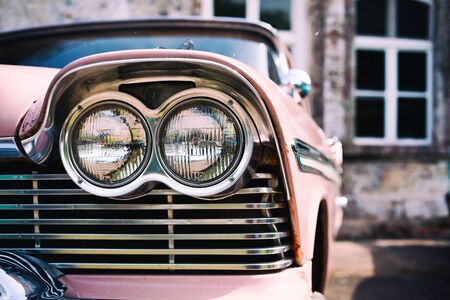 Headlights of pink vintage american car from the 1950s retro Processingの写真素材