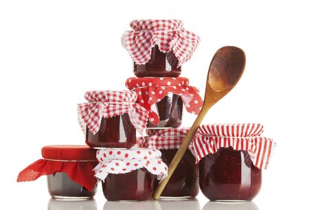 Stack of jars with homemade jam isolated on white backgroundの写真素材
