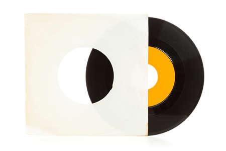Single vinyl record half out of yellowed blank sleeve isolated on white backgroundの写真素材