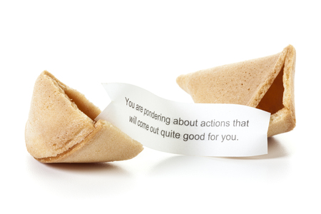 Broken fortune cookie, message slip predicting positive futureの写真素材