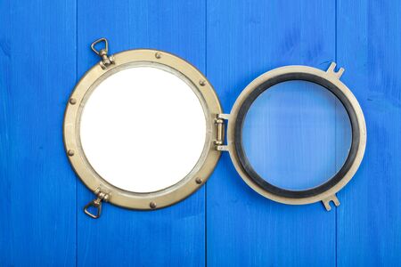 Opened vintage brass porthole, aperture isolatedの写真素材